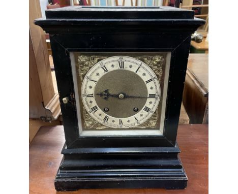 A late 19th century ebonised bracket clock, with a glazed top, front, back and sides, the silvered chapter ring with Roman nu