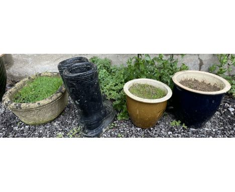 A reconstituted stone planter of circular form, together with a pair of boots planter and two stoneware jardinieres