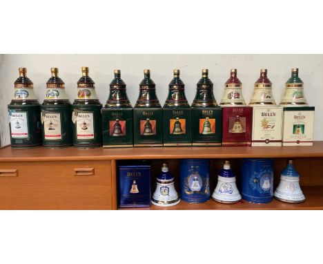 A collection of Bell's Old Scotch Whisky Christmas Decanters for 1989 - 1998 together with a Decanter to Celebrate the Golden