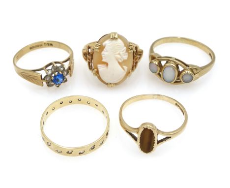 Gold three stone opal ring, three gold stone set rings, all hallmarked 9ct and a gold cameo ring stamped 9ct (5) Condition Re