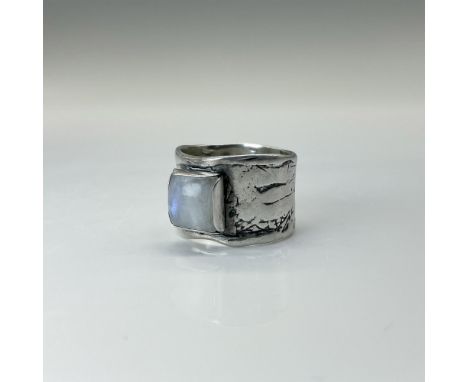 Rustic hammered band with moonstone setting. Marked 925. The ring is approximately size 7.5. Total weight is 10 grams. Dimens