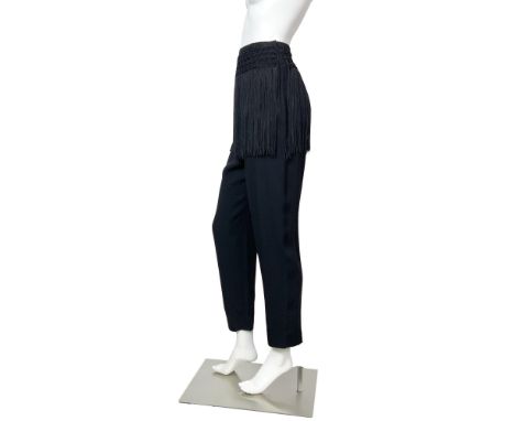 A Dazzling pair of fringed Trousers by Valentino. These Black trousers have a macrame fringed embellishment to the waist line
