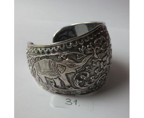 Very wide silver torque bangle embossed  with elephants 63g       