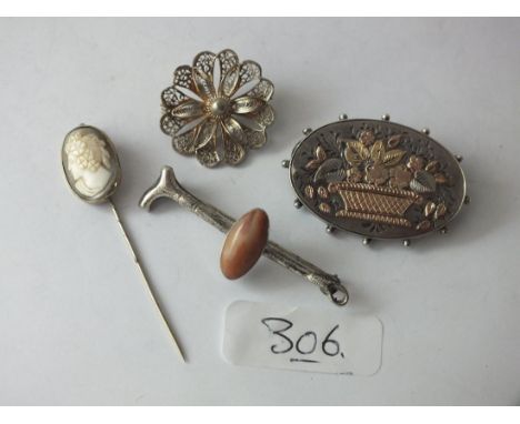 Three silver brooches and a stick pin    