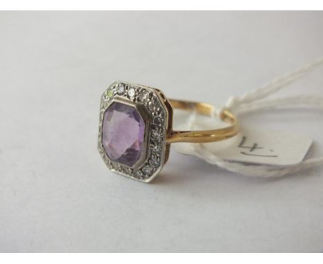 An attractive amethyst and diamond ring set in  18ct. and platinum size O, 4g.     