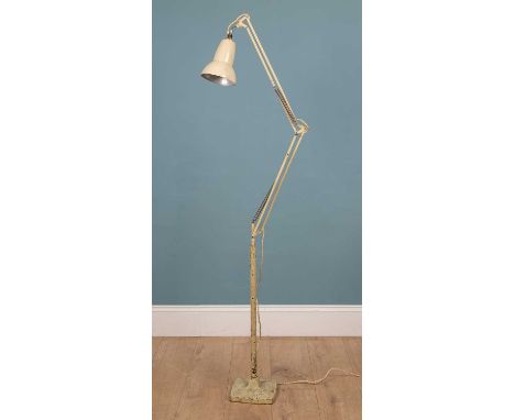 A floor anglepoise lamp, cream coloured, on a squared base, 174cm highUsed condition, with marks, dents and scratches, partic