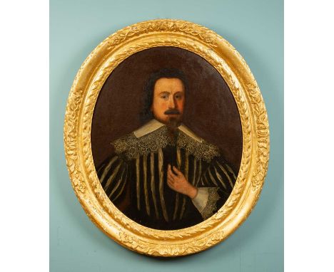 A portrait of a 17th century Spanish nobleman in an ornately carved oval giltwood frame, oil on panel, 96cm high x 83cm width
