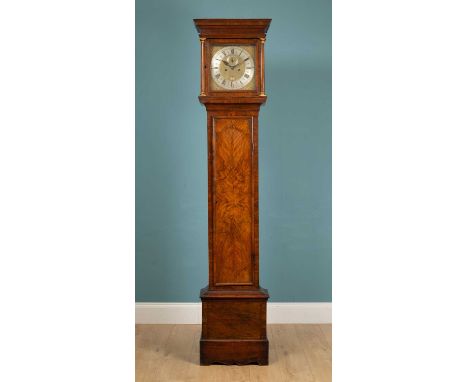 An 18th century and later walnut long case clock, the trunk with quarter veneered door, decorative banded inlay, pilaster col
