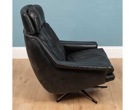 A vintage black leather late 20th century armchair, rotating on a five-legged base, 81cm wide x 86cm deep x 88cm highWear to 