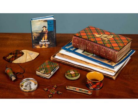 An assortment of various tartan Mauchline ware comprising of one pin cushion; one napkin ring, one cross thread holder; one m