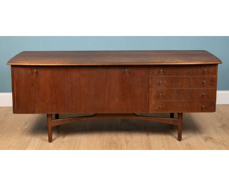 A mid 20th century Dalescraft sideboard, teak, the shaped top over fall down front enclosing a shelf within beside four drawe