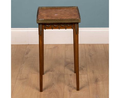 An early to mid 20th century walnut continental lamp table with parquetry inlaid top, brass galleried border, further metal m