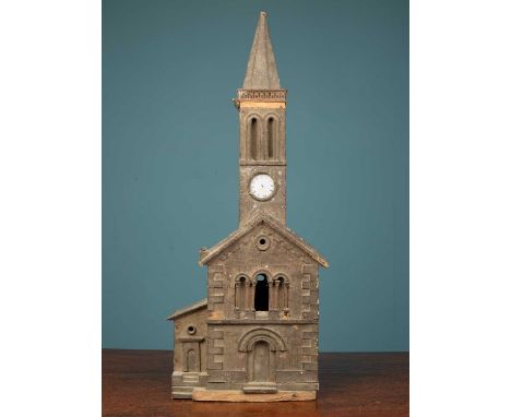 An antique naive model of a church, with hinged opening to the rear, 20cm wide x 8cm deep x 52cm highLosses overall and in ne