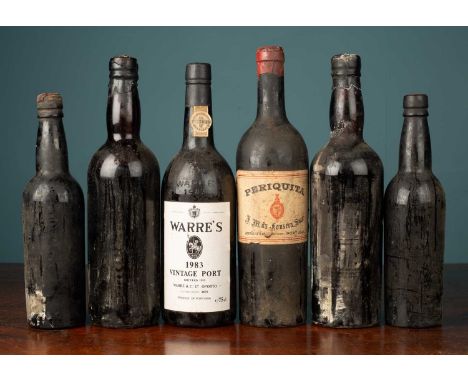 A bottle of Warre's Vintage Port 1983 together with an old bottle of Periquita wine; two bottles of port from the 1950s; and 