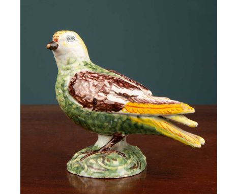 An 18th century Dutch Delft model of a bird, 10cm long x 9.5cm highMinor frits to the extremities due to age, broken where th