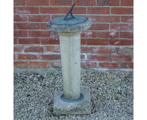 A cast reconstituted stone garden sundial the octagonal top with bronze dial plate, 32cm diameter x 75cm high (not including 