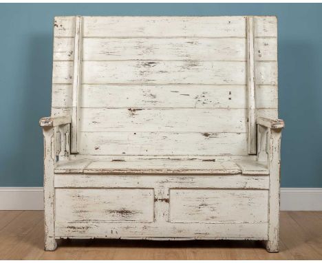 An antique pine monks bench, white painted and with scrubbed top, the top 144.5cm x 91.5cm deep, the box base with hinged lid