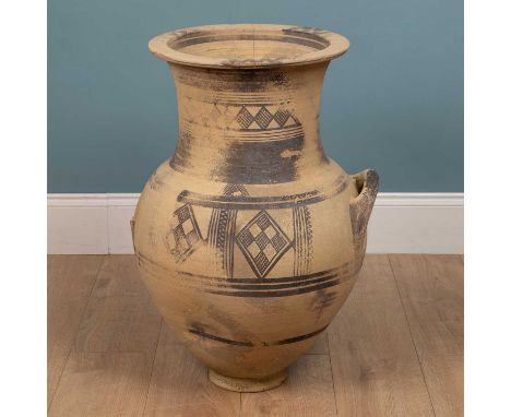 A Cypriot terracotta jar, c.800BC, with bands of painted decoration and further geometric ornament and with two lug handles (