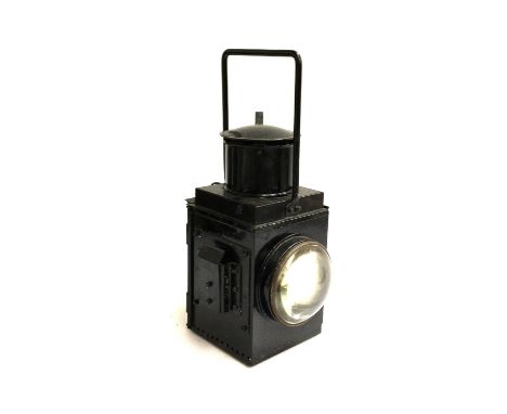A vintage railway lamp, with two brass lenses intact