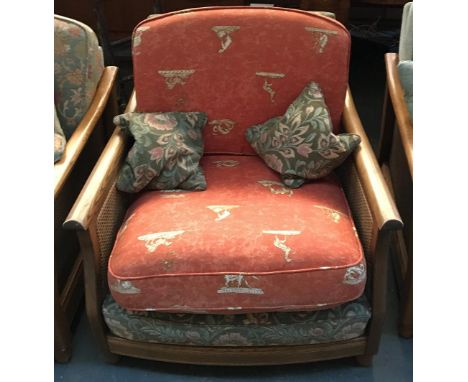 A further Ercol light oak bergere armchair, with caned sides, upholstered in green and red fabric, 90cmW 
