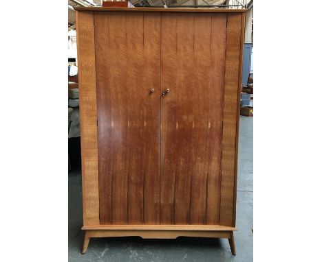 A mid century wardrobe by Alfred Cox for Handcraft Quality Furniture, also bears stamp for Grange Furniture, the two doors, o