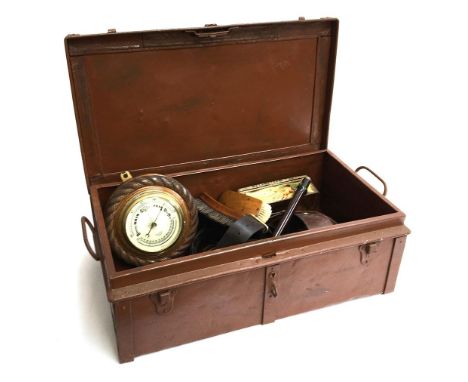 A tin travel trunk 61cmW, containing a small quantity of tack, brushes, barometer etc 