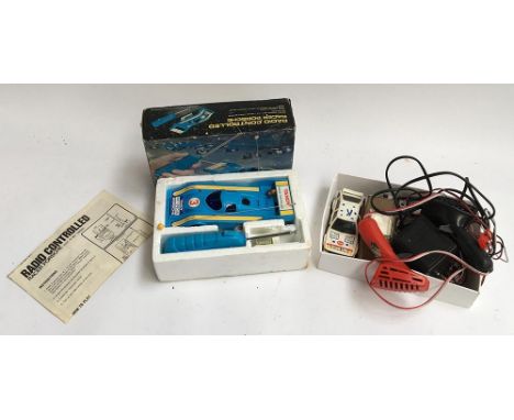 A small lot of Scalextric, with power unit and hand controllers, and a boxed radio controlled racing