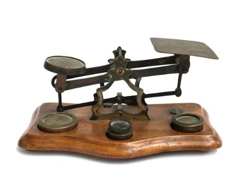 A vintage set of postal scales, with four weights 