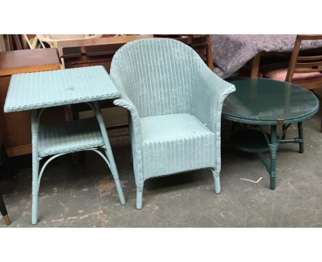 A Lloyd Loom style wicker armchair and table, painted in a light blue, the table 53x53x70cmH; together with one other circula