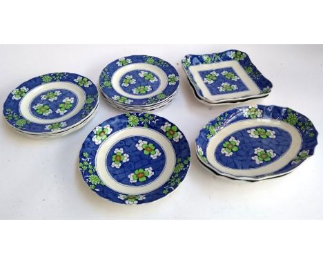 A Copeland Spode blue and white part dinner service decorated with green and yellow flowers, comprising plates, platters etc,