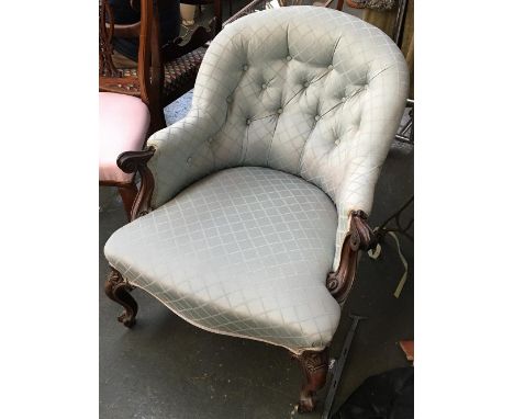 A good 19th century continental button back salon chair, with serpentine front, on carved cabriole legs and casters 