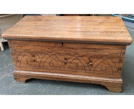 A 19th century pitch pine blanket box, hinged lid, the front carved 'SF 1640', on bracket feet, approx. 113x59x59cm 