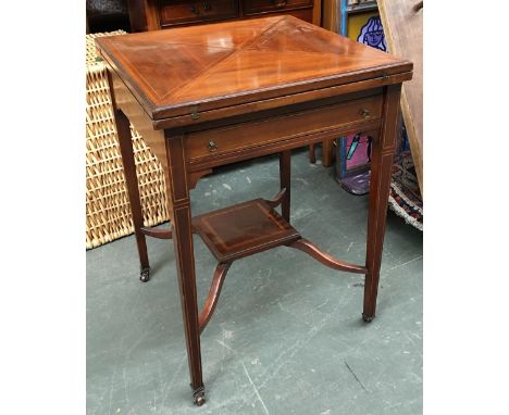 A 19th century mahogany and banded card table, four flap swivel top, single drawer, on square tapered legs, with undershelf a