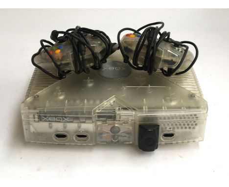 An Xbox console with two controllers