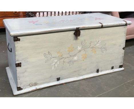 A substantial Eastern teak chest from Myanmar, painted a light blue with floral decoration, the interior with candle box, 130