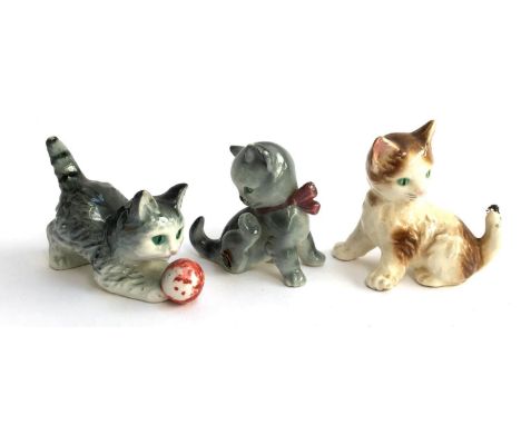 Three Goebel cat figurines, two with bugs 