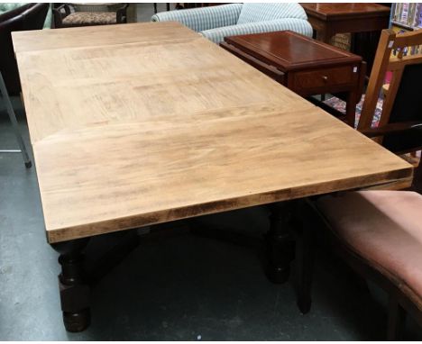 A substantial oak draw leaf table, the top recently refinished to a light oak, on substantial cup and cover base, 130x100x76c