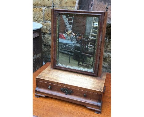 A small Regency adjustable dressing mirror, with single drawer, on moulded bracket feet, 42cmH 