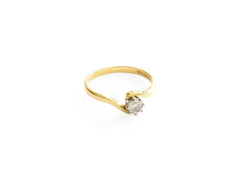 An 18 Carat Gold Diamond Solitaire Ring, the round brilliant cut diamond in a white illusion setting, to a yellow twist shoul
