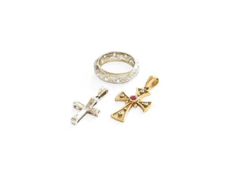 A 9 Carat Gold Ruby and Diamond Cross Pendant, measures 3.12cm by 1.7cm; A 9 Carat White Gold Diamond Cross Pendant, measures