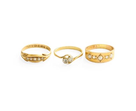 An 18 Carat Gold Diamond Five Stone Ring, the graduated old cut diamonds in yellow claw settings, to a lozenge shaped surroun