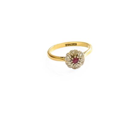 A Synthetic Ruby and Diamond Cluster Ring, the round cut synthetic ruby within a border of eight-cut diamonds, in white claw 