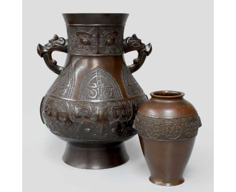 A Chinese Bronze Twin Handled Vase, of archaic form bearing character marks to base, later drilled and used as a lamp base, 3