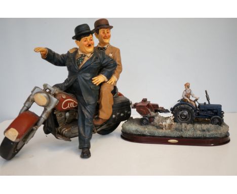 Large Laurel & Hardy figure on motorbike(Motorbike A.F) together with a modelled tractor 