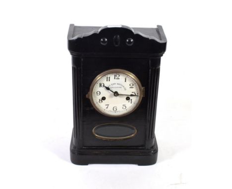 An ebonised striking mantel clock, dial signed East End Watch Company, Calcutta, twin-barrel movement striking on a gong