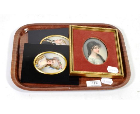A pair of portrait miniatures painted on porcelain together with with a larger example (3)