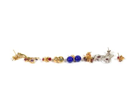 Three pairs of 9 carat gold gem set stud earrings comprising of ruby, aquamarine and garnet; a pair of lapis lazuli stud earr