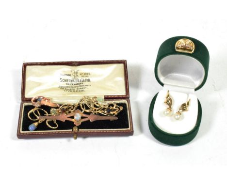 An opal set bar brooch, stamped '9C', length 6.4cm, boxed; and six pairs of earrings stamped '375' or '9K'.  Gross weight - 1