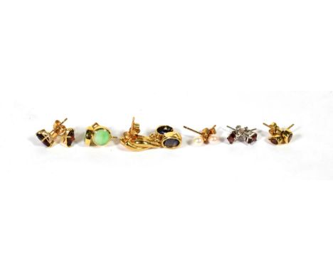 A pair of 9 carat gold jade stud earrings; and five other pairs of unmarked gem set earrings including garnet, iolite etc .  