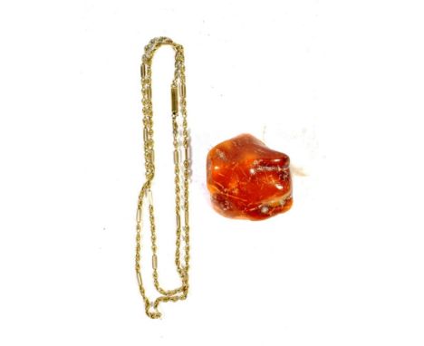 A fancy link necklace, with an applied plaque stamped '9C', length 49cm; and an amber piece.  Fancy link necklace - 6.01 gram